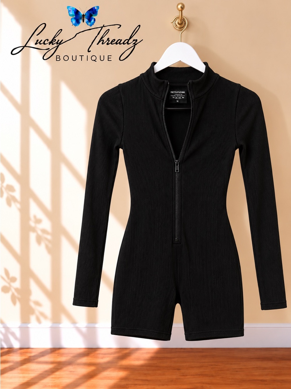 PLT Black Ribbed Mock Neck Zip Front Long Sleeve Unitard Romper